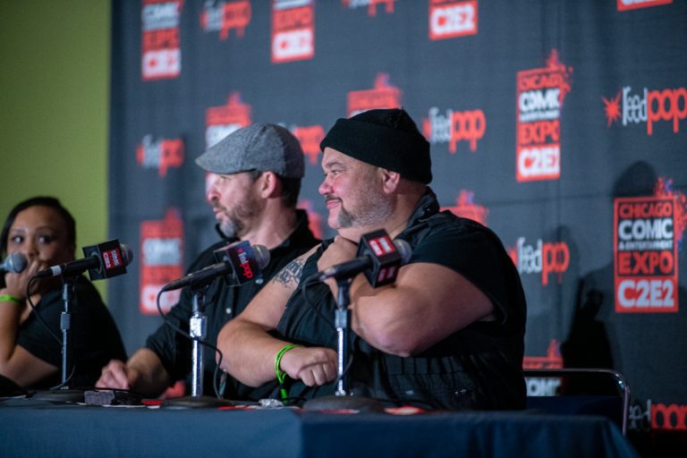 Paul Schrier (Bulk) of the Mighty Morphin Power Rangers shows off a tattoo during a panel discussion at C2E2 2021. Photo by Aaron Cynic.