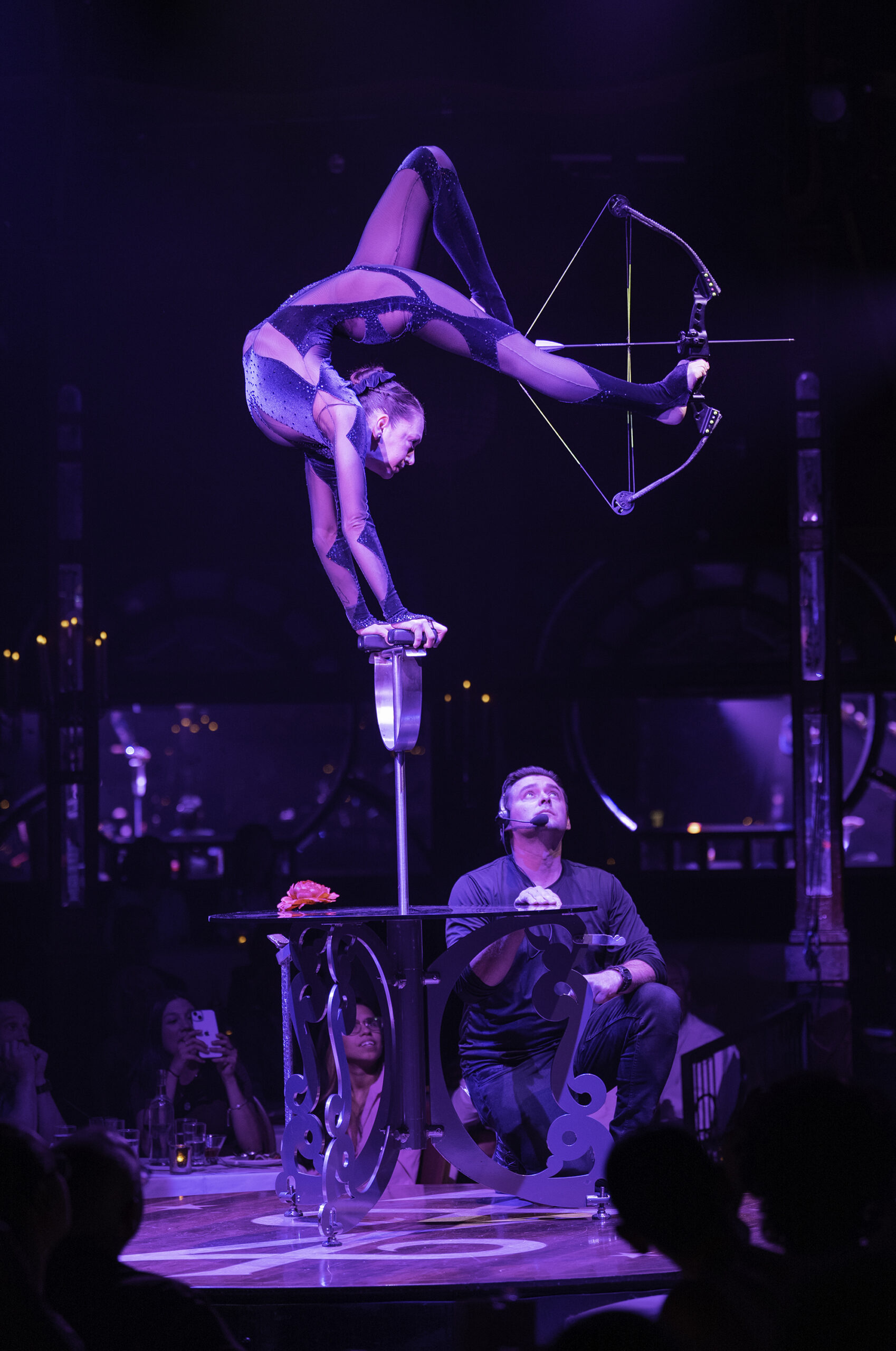 Contortionist Elayne Kramer in LOVE, CHAOS, & DINNER. Photo Credit: Elliot Fisher